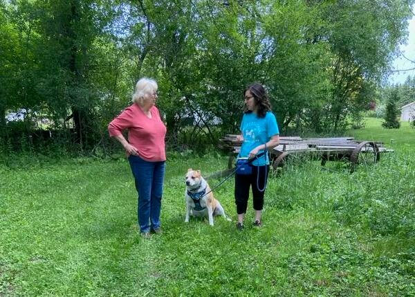 Carly Rosenthal conducting an in-home dog training session in a Waukesha-area home